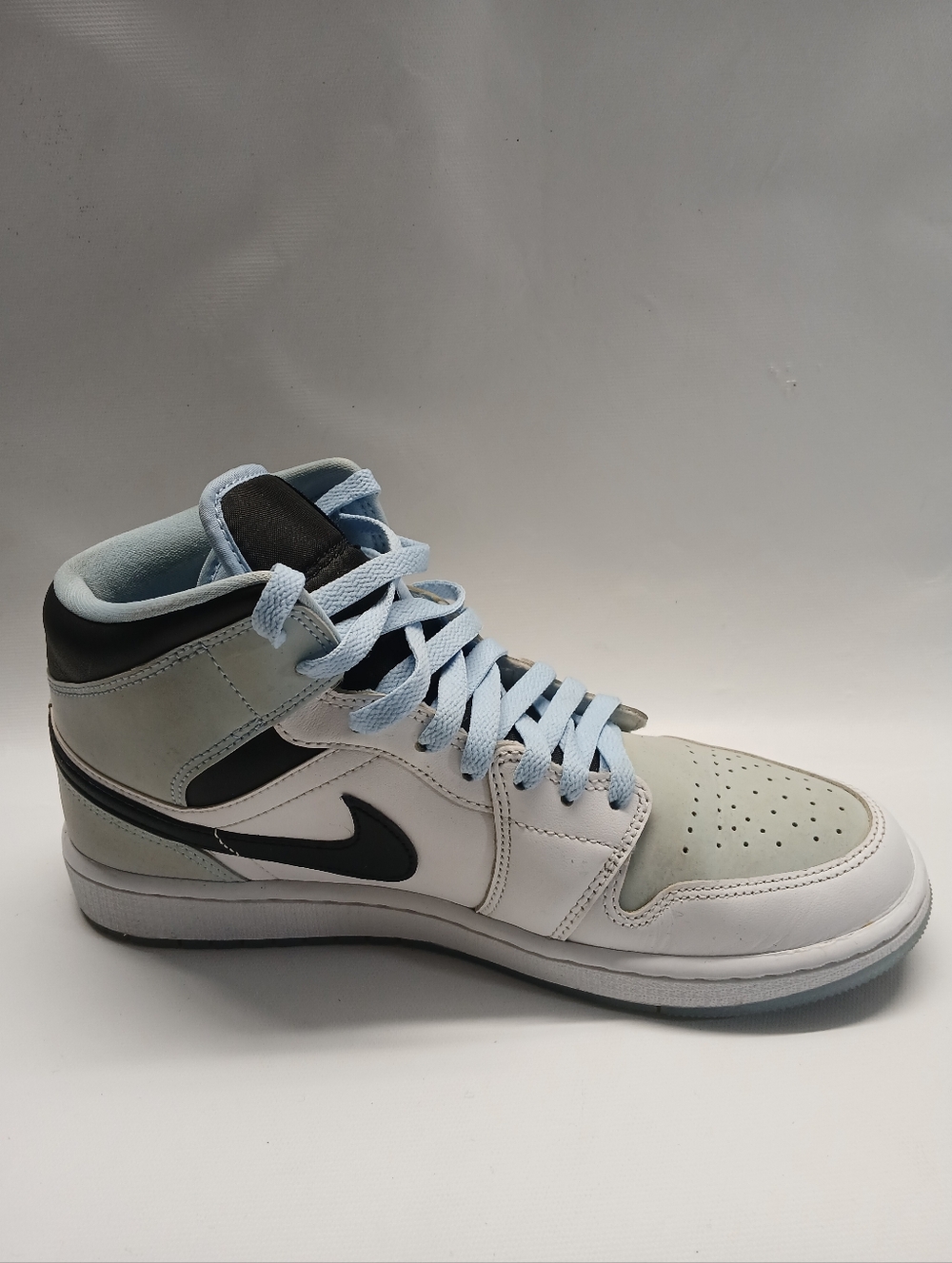 Nike Air Jordan 1 Mid White Ice  Blue and White Men's Basketball Sneaker.